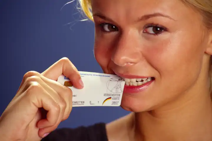 Young woman with card of her health insurance