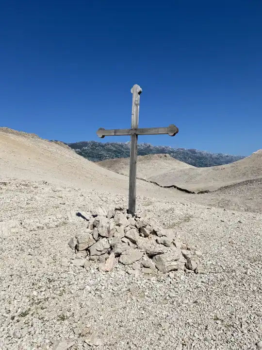 Wooden cross in the former concentration camp Slana, on the Adriatic island of Pag, Croatia, Europe