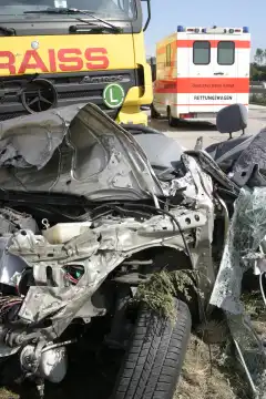 Vehicle wreck after a big crash of a car with a truck