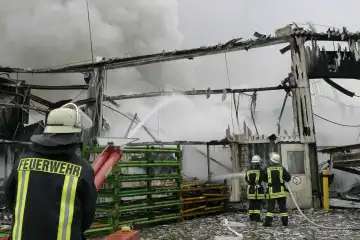 Firemen at last erasure works at a burned building
