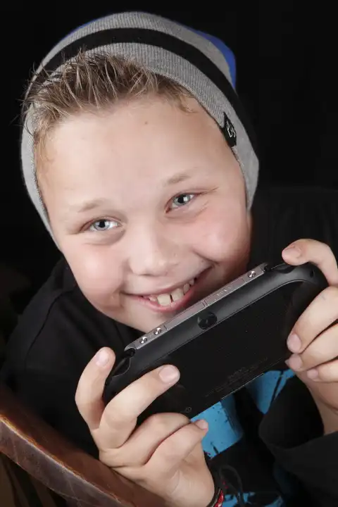 Young boy mith Playstation II