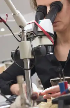 Woman working on Microscope