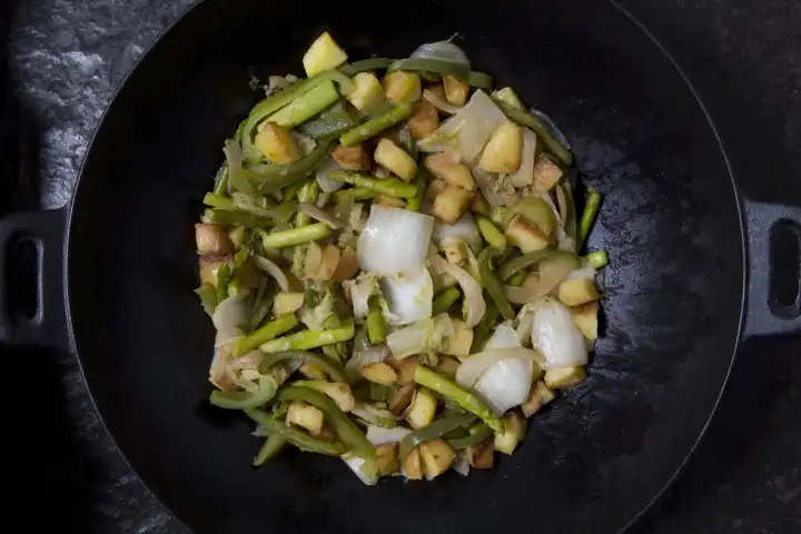 wok with vegetables and roast potatoes