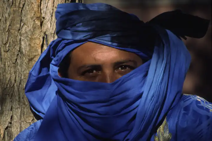 Oriental man with blue headscarf