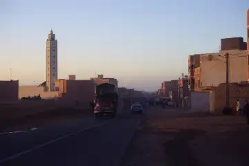 street and mosque at dusk in Inezgane, Morocco