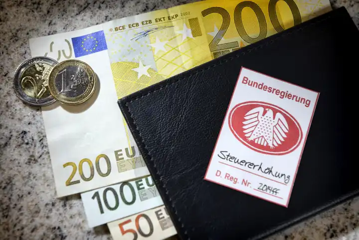 German federal eagle seal on wallet, tax increase