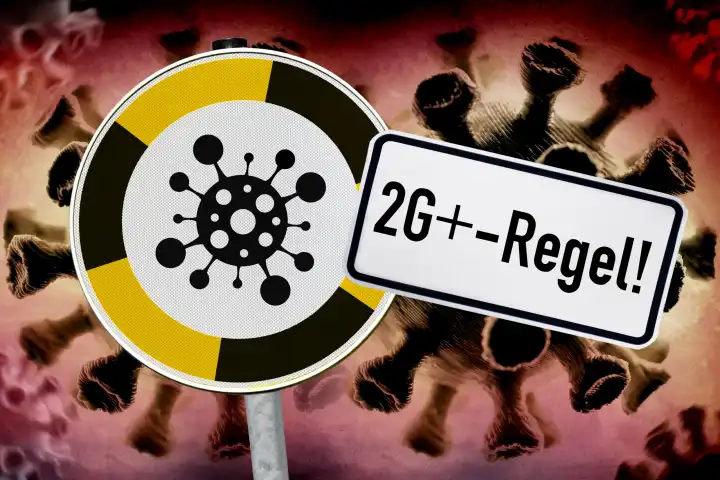 Schild mit Corona-Symbol und Schild mit Aufschrift 2G plus-Regel, Symbolfoto für zusätzliche Testung von Geimpften und Genesenen