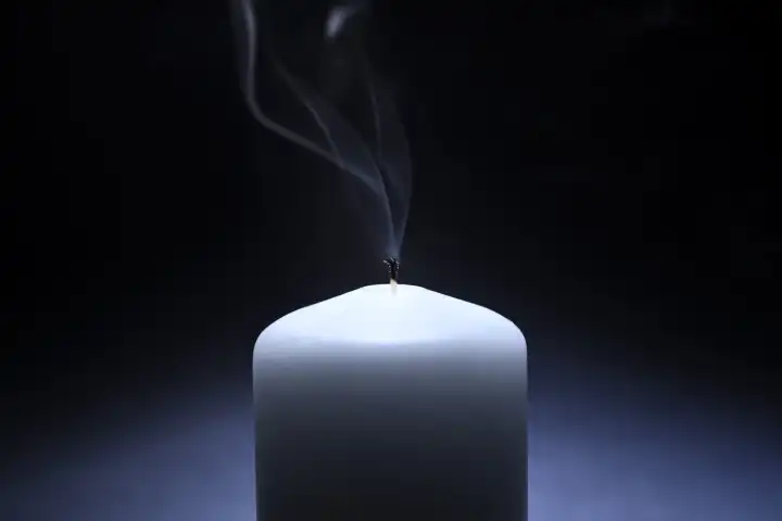 Extinguished candle, symbol photo blackout