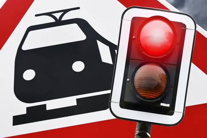 Railroad sign and red stop signal, symbol photo railroad strike