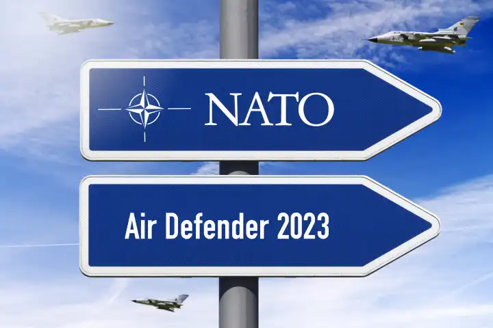 Signpost with inscription NATO and Air Defender 2023, NATO air maneuver.