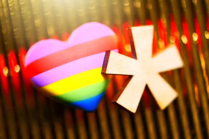 Gender star with heart in rainbow color, symbol photo gender language