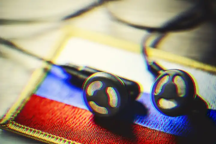 Headphones on Russia flag, symbolic photo Taurus wiretapping affair
