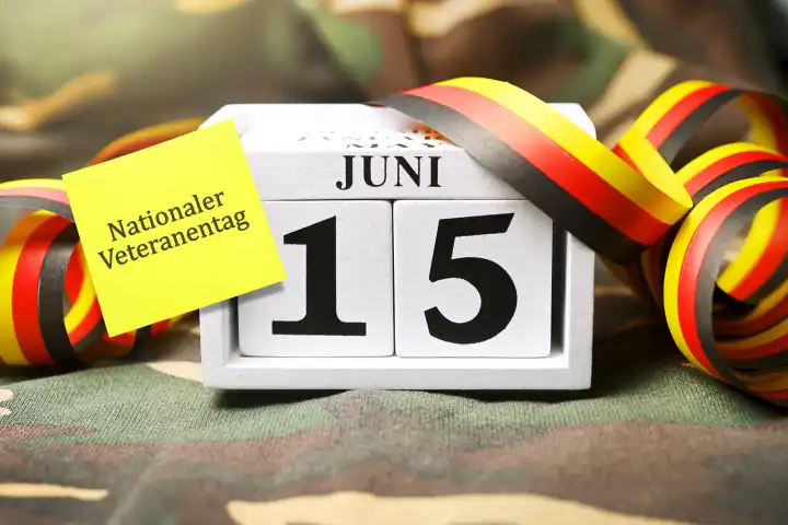 Calendar date June 15 with Germany garland, annual national Veterans Day, photomontage