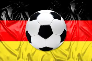 Black and white leather soccer ball with flag of Germany, photomontage
