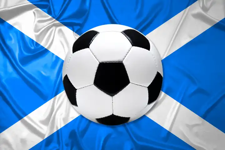 Schwarz-Weißer Lederfußball mit Fahne von Schottland, Fotomontage