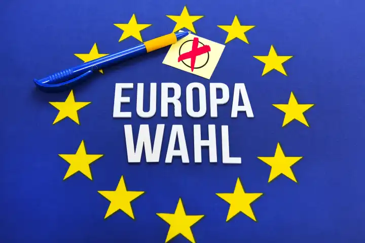 European flag with European election lettering and electoral cross, photomontage