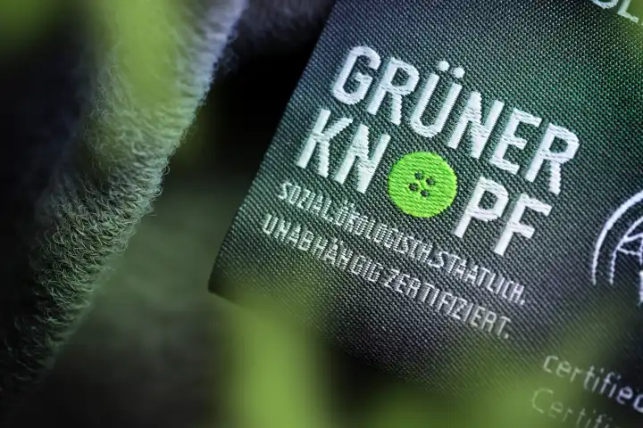 Green button, state seal for labeling sustainable textiles, label on a textile