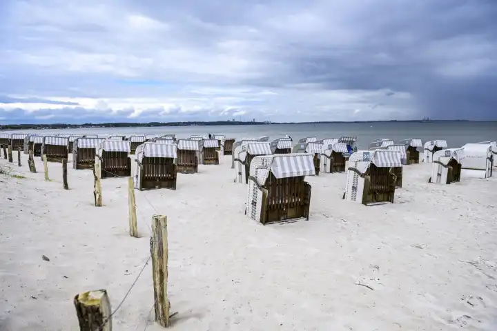 Baltic Sea beach with empty beach chairs in bad weather in Scharbeutz, Schleswig-Holstein, Germany