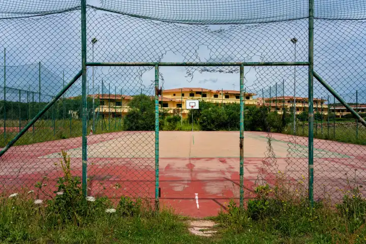 neglected sports field on a holiday complex in Sardinia