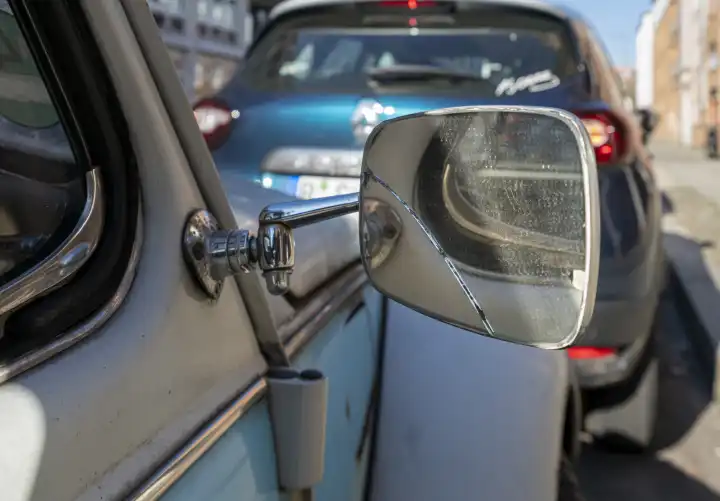 Exterior mirror on an old VW Beetle, Berlin, Germany