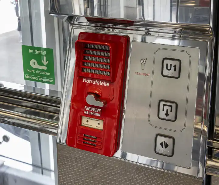 red emergency call keypad in elevator, Vienna, Austria