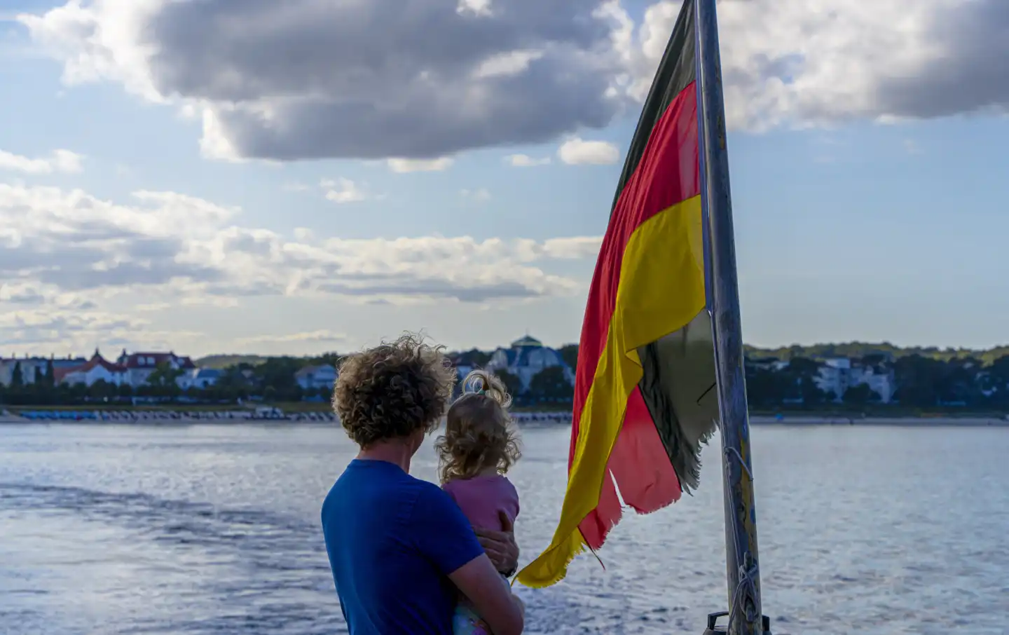 German flag in front of a blue sky, island of Rügen, Germany