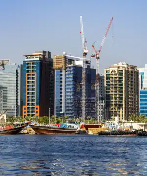 Skyline and boats at Dubai Creek, Dubai, United Arab Emirates, Middle East, Asia