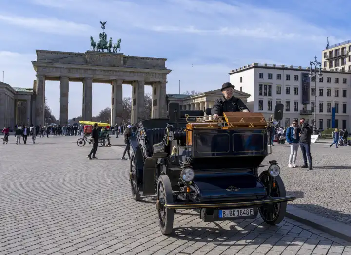Vintage electric vehicle in front of the Brandenburg Gate, Berlin, Germany