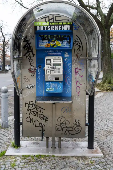 Damaged public telephone building, Berlin, Germany