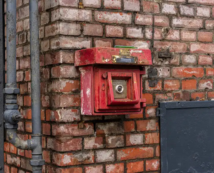 Historic fire alarm on a brick wall, Berlin, Germany