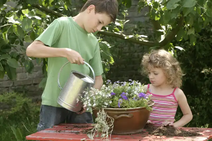 Boy and Girl Gardening