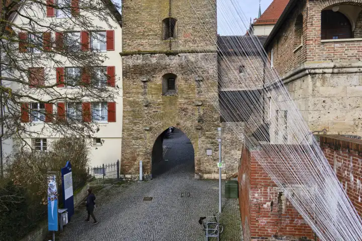 Ulm, Baden-Württemberg, Germany, Europe, the Metzgerturm, also known as the Schiefer Turm von Ulm, here with installation of cords by the artist Johannes Pfeiffer, condition 4. February 2023.