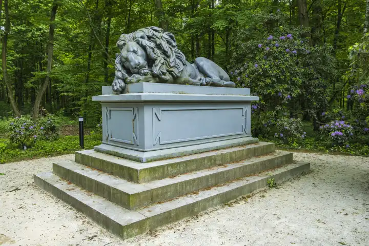 Resting lion, monument to Eugen von Württemberg in the castle park of Bad Carlsruhe (Pokoj), Namslau district (Namyslow), Opole voivodeship, Upper Silesia, Poland.