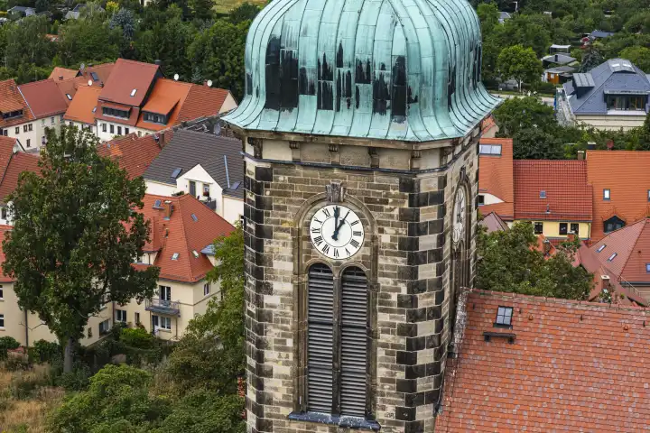 At one o'clock, 1 p.m., but now it strikes 13 or 60 minutes past twelve, time on the tower clock of the town church in Stolpen, Saxony, Germany.