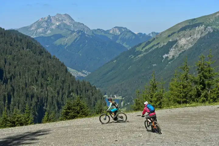 Two mountain bikers on a descent in the Chablais Geopark, Montriond, Chablais, France