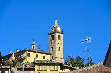 The bell tower rises above the old town of Monforte d'Alba, Piedmont, Italy