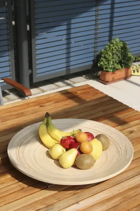 Fruit bowl on wooden table