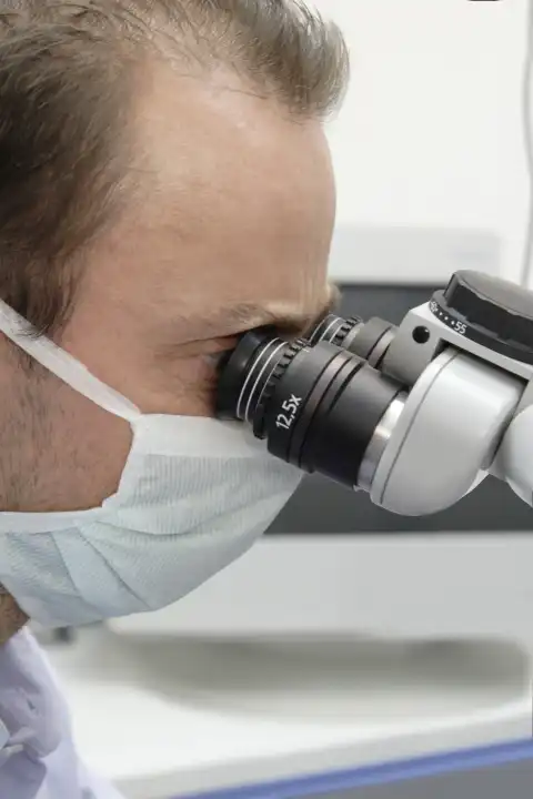 Dentist with microscope