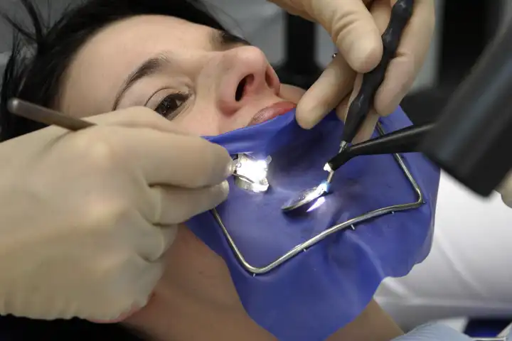 Dental treatment with a cofferdam