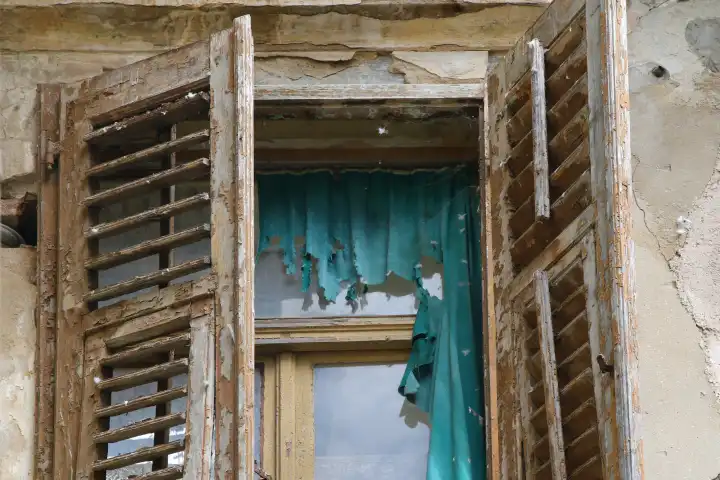Old house with green curtain