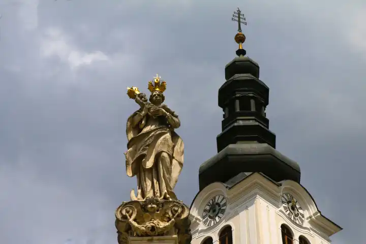 Marian column and town hall tower in Bad Radkersburg, Styria