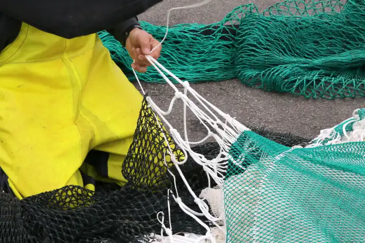 Mending a fishing net