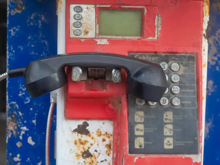 Old, weathered payphone with keypad