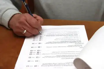 A woman fills out a form