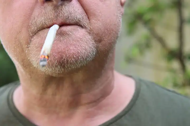 A man smokes a joint