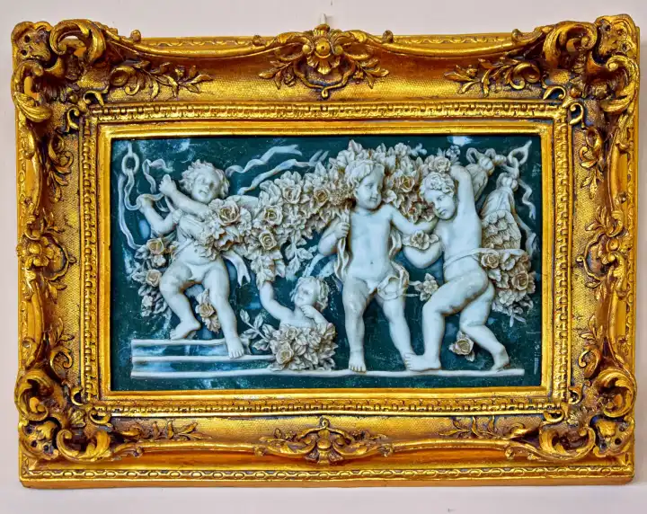 Porcelain picture in golden frame