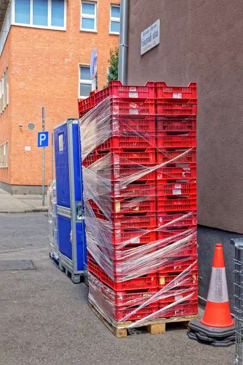 Stack of red bottle carriers