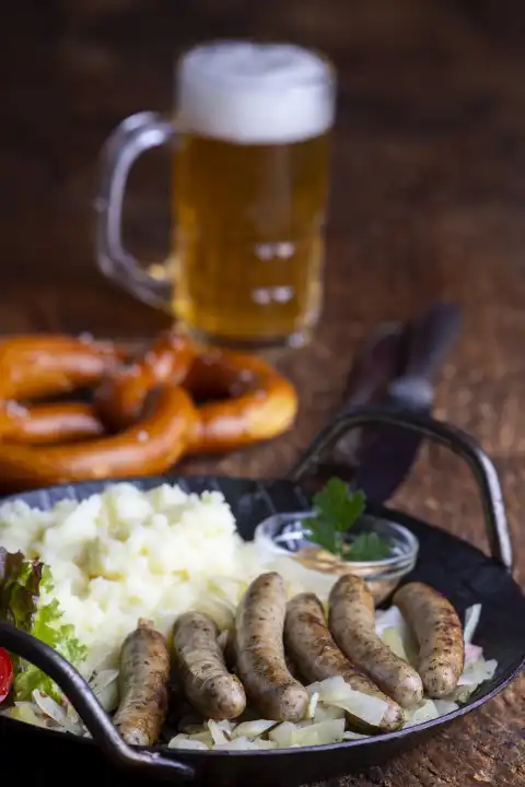Nuremberg sausages with sauerkraut on wood