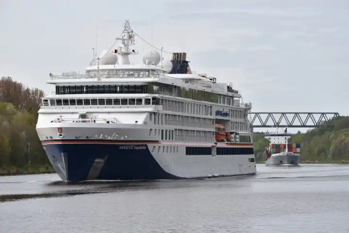 Cruise ship and container ship are underway in the Kiel Canal