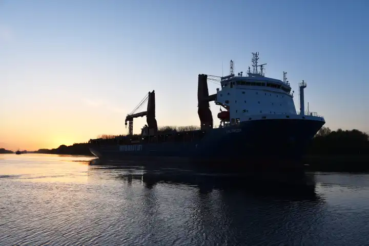 Shipping traffic at sunrise in the Kiel Canal